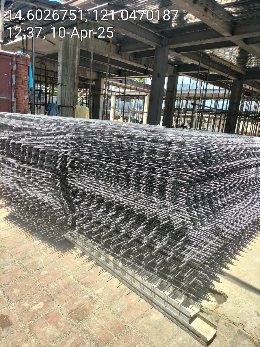 Large consignment of steel matting inside structure under construction — Una Wire Products