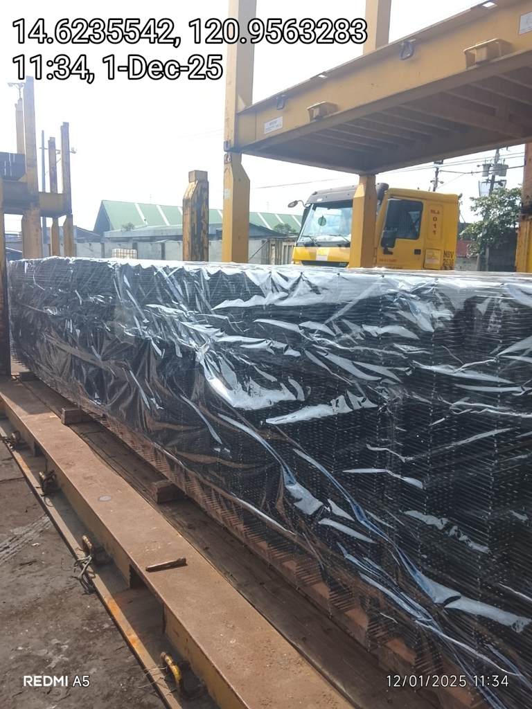 Steel matting wrapped and loaded on flatbed truck for infrastructure delivery — Una Wire
