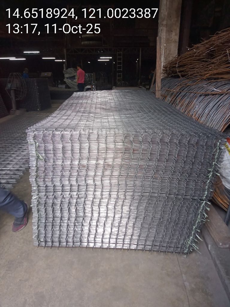 Galvanized steel matting sheets stacked in warehouse — Una Wire Products